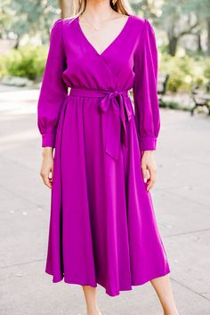 We are all about you and making you feel your best! And we think this is just the dress to do that! The elastic/tied waist keeps this beauty wonderfully flattering and that color is stunning! This long sleeve midi dress is going to look fabulous for any fall wedding! This midi dress features long sleeves, a surplice v-neck, and an elastic waistband with a tied sash. 
Material has no amount of stretch.Cam is wearing the small. True Winter Palette, Magenta Dress, Magenta Purple, Purple Midi Dress, Anniversary Ideas, Medium Purple, Long Sleeve Midi, Long Sleeve Midi Dress, Fashion Essentials