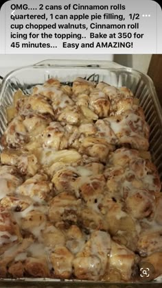 a pan filled with cinnamon rolls covered in icing