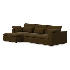 a brown sectional couch with pillows on it's back and the seat folded out