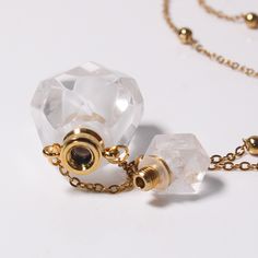 PLEASE NOTE: Our crystal stones are natural minerals and each crystal is unique. The internal ice cracks, pits, mineral points, and color differences of natural crystals are all formed naturally and are normal phenomena, which will not affect the efficacy, beauty and value of the crystal at all.This cute perfume bottle necklace is functional with a screw-off top that allows you to put a small amount of your favorite essential oil or perfume inside. This cutie would make a super special gift for Elegant Silver Mineral Crystal Necklace, Faceted Mineral Crystal Spiritual Necklace, Healing Faceted Crystal Necklaces, Clear Glass Jewelry For Healing, Clear Glass Healing Jewelry, Spiritual Faceted Mineral Crystal Necklaces, Gold Mineral Crystal Necklace With Stones, Elegant Gemstone Crystals For Jewelry Making, Elegant Pendant Crystal Necklaces With Raw Stone