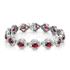 Oval shaped intense color intensity eye clean 14 rubies in 14K white gold bracelet. #lovenecklaceforher #fallbracelets #coolbraceletsdiy #jewelrynecklaces #braceletsidea Red Diamond Oval Bracelet, Red Oval Diamond Bracelet, Red Oval Diamond Classic Bracelet, Red Oval Classic Diamond Bracelet, Classic Red Oval Diamond Bracelet, Red Oval Diamond Gemstone Bracelet, Red Diamond Oval Tennis Bracelet, Oval Ruby Tennis Bracelet For Formal Occasions, Oval Ruby Diamond Bracelet