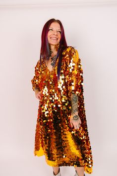 Get ready to steal the show in our dazzling mid paillette sequin caftan! This striking caftan is adorned with shimmering paillette sequins that will turn heads and make you the center of attention. Perfect for a night out on the town, a special occasion, or just because you deserve to feel fabulous. The flowy, relaxed fit make it comfortable to wear all night long, while the short length ensures drama and fun. These sequins on soft mesh assure comfort and they are unlined meaning they won't be t Glamorous Festive Sequin Dress With Contrast Sequin, Festive Glamorous Sequin Dress With Contrast Sequins, Glamorous Festive Contrast Sequin Dress, Glamorous Gold Dress With Mirror Work, Festive Sequin Dress With Contrast Sequin, Festive Shimmer Sequin Dress For Party Season, Disco Style Sequined Dresses For Festivals, Disco Style Sequined Festival Dresses, Glamorous Sequined Dresses For Festival