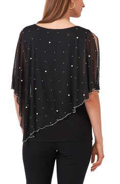 Add a layer of playful elegance with this asymmetric, cape-like top covered in sparkling beads and pearly baubles. 22" length Jewel neck Elbow-length sleeves 96% polyester, 4% spandex Hand wash, line dry Made in the USA Chic Evening Tops With Cape Sleeves, Elegant Pearl Embellished Tops For Spring, Elegant Party Blouse With Overlay, Spring Evening Top With Pearl Embroidery, Chic Evening Tops With Pearl Embroidery, Elegant Summer Top With Cape Sleeves, Party Fitted Blouse With Overlay, Pearl Embroidered Evening Top For Spring, Fitted Party Blouse With Overlay