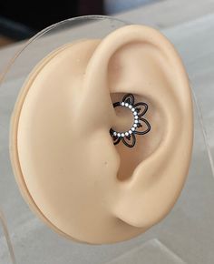 an ear with a ring on top of it