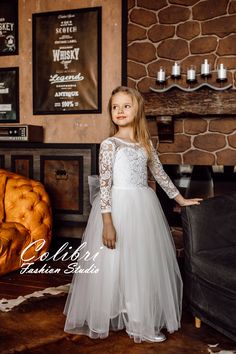 First communion dress,Flower girl dress long sleeve, Flower girl dress, ,Wedding girl dress, Flower girl dress ivory, Flower girl dress boho Delicate and light flower girl dress. The top of the dress is made of guipure with a floral pattern. Sleeve length 7/8. The dress has a not deep V-neck at the back. The multi-layer skirt is made of soft tulle. The dress can be complemented with a satin or tulle belt of your choice. This amazing flower girl dress is perfect for a wedding, birthday, first com Flower Girl Dress Long Sleeve, Long Sleeve Flower Girl Dress, Communion Dresses Lace, Elegant Flower Girl Dress, Ivory Girls Dress, Blush Flower Girl Dresses, Lace Flower Girl Dress, Long Flower Girl Dresses, Satin Flower Girl Dress