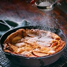 an apple pie is being sprinkled with sugar