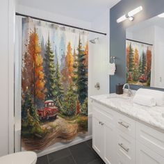 a bathroom with a painting on the shower curtain