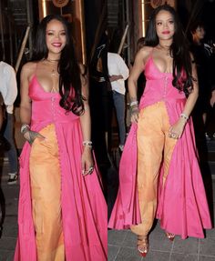 two women in pink and orange outfits standing next to each other