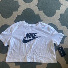 The Nike Sportswear Essential T-Shirt Sets You Up With Soft Cotton Jersey And A Cropped Hem. Benefits Cotton Fabric Is Soft And Comfortable. Cropped Hem Hits Above The Hips. Sporty White Cropped T-shirt With Logo Print, Nike Cropped Short Sleeve T-shirt For Sports, White Workout T-shirt With Logo Print, White Athleisure T-shirt For Sports Season, White Athleisure T-shirt With Logo Print, Nike Casual Workout T-shirt, Sporty Moisture-wicking Cropped T-shirt With Crew Neck, Sporty Cropped T-shirt With Logo For Streetwear, Sporty White Workout T-shirt