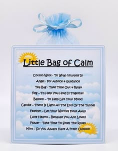 a little bag of calm sign with blue ribbon