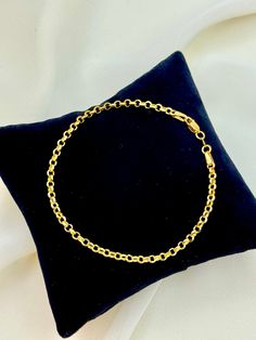 18k Gold Rolo Bracelet , 2.15 gr,3mm,7.5 inches with lobster clasp . please text me know if you want any specific sizes and also matching necklace is available . This is a Trending Etsy Bestselling Rolo Bracelet . It is made with Authentic Genuine 18K Gold. Easy to layer! Looks beautiful with your favorite other bracelet or even if you wear it alone. BEST PRICE ON ETSY FOR SOLID 18kGOLD NECKLACES! Premium spring Hook for added safety! Priced to sell! Compare our prices to other similar sellers! 14k Gold Rolo Chain Bracelet Gift, Formal Gold Bracelet With Rolo Chain, Formal Gold Rolo Chain Bracelet, Gold Bracelets With Rolo Chain As Gift, Rolo Chain Link Charm Bracelet As Gift, Gold Rolo Chain Bracelet As Gift, Gold Plated Cable Chain Bracelet For Gift, Yellow Gold Charm Bracelet With Cable Chain For Gift, Yellow Gold Rolo Chain Bracelet