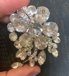 "Beautiful 1950's vintage EISENBERG ICE brooch! Flower spray design in Rhinestones, set in Rhodium-plated brooch - very unique and classic All original stones in place, item is used but stunning Clean backing with \"Eisenberg Ice\" and number" Eisenberg Ice Jewelry, Vintage Crystal Brooches For Formal Occasions, Vintage Sparkling Brooches For Formal Wear, Vintage Sparkling Brooches For Formal Occasions, Vintage Crystal Brooches For Anniversary, Vintage Sparkling Brooch For Formal Occasions, Vintage Anniversary Brooch With Sparkling Stones, Vintage Bling Brooches For Anniversary, Vintage Crystal Brooch With Bling