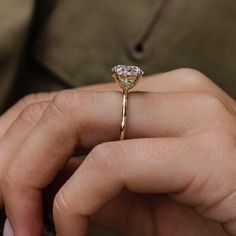 A 3.5 carat round brilliant set in our minimal Harper Solitaire setting, in 14k Yellow gold----------------------------- 3.5 carat center (1 ratio)- 9.5mm round brilliant cut, modern white moissanite in a 14k Yellow gold settingA 14k Yellow gold base crafted into a unique design, beautified with diamonds, perfect causal diamond Ring, to uplift your trendy and snazzy outfits.This beautiful Diamond ring is in 14k Yellow gold; Please get in touch with us for any customization requiredComes with a f Modern Moissanite Round Cut Wedding Ring, Modern Brilliant Cut Jewelry For Proposal, 5ct Round Engagement Ring, Snazzy Outfits, Expensive Rings, Round Engagement Ring, Grading System, Beautiful Diamond Rings, Solitaire Setting