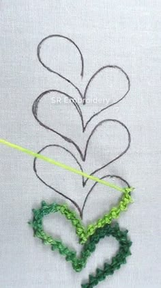 the heart is made up of green crocheted thread and has been stitched together