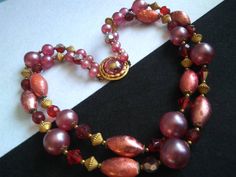 ON SALE Vintage 1950s Chunky Beaded Multi 2 Strand Maroon Purple Glass Necklace, Retro Mid Century Collectible Rockabilly Germany Jewelry 1960s Accessories This is a fabulous and stunning chunky vintage necklace The 2 strand necklace measures about 20 inches So it is fabulous look, gotta love that Very nice addition to any collectible mid century collection. For more purses.... https://www.etsy.com/shop/MartiniMermaid?ref=listing-shop2-all-items-count&section_id=8097288 For more bracelets ht Vintage Colorful Beaded Necklaces For Festive Occasions, Retro Red Necklace For Party, Vintage Polished Beads For Festive Occasions, Vintage Double Strand Beaded Necklace With Large Beads, Vintage Double Strand Beaded Necklaces With Large Beads, Vintage Double Strand Beads For Jewelry Making, Vintage Oval Beaded Necklaces For Jewelry Making, Festive Vintage Beaded Necklaces With Polished Beads, Vintage Red Single Strand Jewelry