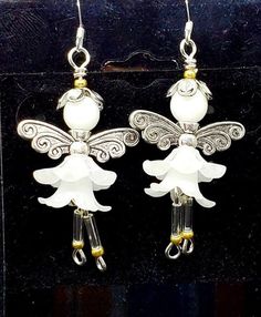 Adorable little Snow fairies dangling from your ears are sure to gather compliments of cuteness. Approx 1.25 to 1.5 inches long. French hook with silcone stopper on ear wire which is also made of Sterling Silver. White lucite flowers, white glossy glass bead, and silver colored wings and hat are used to create these little fairies. Whimsical White Jewelry With Flower Charm, Whimsical White Flower Earrings, Whimsical Silver Dangle Flower Earrings, Whimsical Adjustable White Earrings, Whimsical Silver Flower Earrings, Whimsical White Dangle Jewelry, Silver Whimsical Flower Earrings, Whimsical White Flower Earrings With Ear Wire, Whimsical White Hypoallergenic Earrings