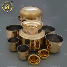 an assortment of metal pots and pans with lids