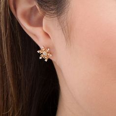 With a flurry of sparkle, these diamond stud earrings the of winter. Fashioned in warm 10K gold, each fanciful earring features a sculpted snowflake dotted with shimmering diamonds. Radiant with 1/8 ct. t.w. of diamonds and a brilliant buffed luster, these post earrings secure comfortably with friction backs. Sparkling 14k Gold Earrings For Gift, Sparkling Yellow Gold Diamond Earrings Gift, Diamond Stud Earrings, Diamond Stud, Flower Jewellery, Earring Backs, Diamond Stone, Diamond Clarity, Gold Bangles