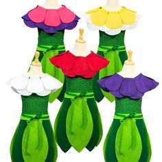 three dresses made out of paper with different colors and shapes on the top, one is green