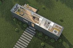 an aerial view of a shipping container home with stairs leading up to the second floor