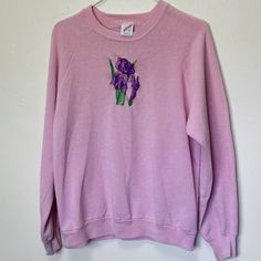 Adult L Jerzees cotton poly blend 44" chest 24" length Rad vintage Jerzees pink crewneck sweatshirt with a purple iris on the chest-- def had some wear on the embroidered graphic and there's a spot on the chest and some discoloration on the wrists. Still super cool and wearable. Pink Crewneck Sweatshirt, Purple Iris, Rose Vintage, Pink Crewneck, Pink Sweatshirt, Super Cool, Mother’s Day, Crewneck Sweatshirt, Sweat Shirt