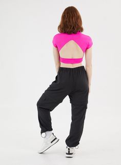 It doesn't get more functional than the Double Take Pant. One minute they're the chicest, most comfortable activewear pant of your dreams, and the next they're your favorite high waisted active shorts. The pants feature two cargo pockets, hidden zippers for a seamless transition into shorts, and adjustable ankles to make it as easy as possible to slip the bottom half off over your sneakers. Running from afternoon workout to a fun happy hour with friends? Ditch the sneakers, cinch the adjustable Moisture-wicking Cargo Pants For Workout, Moisture-wicking Sportswear Cargo Pants For Workout, Sporty Stretch Cargo Pants With Moisture-wicking, Sporty Stretch Cargo Pants For Workout, Stretch Cargo Pants For Workout, Athleisure Cargo Pants With Side Pockets For Gym, Sporty High Waist Pants With Built-in Shorts, Athleisure Cargo Pants With 4-way Stretch For Sports, Athleisure Stretch Cargo Pants With Side Pockets