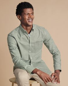 100% cotton, Available in classic, slim and extra slim fit, Non-iron, Button-down collar, Rounded button cuff with two buttons, Classic and slim fit: back pleats, Extra slim fit: back darts, Left chest pocket, Machine washable - Button-Down Collar Non-Iron Twill Gingham Check Shirt - Olive Green | Men's Charles Tyrwhitt Button-Down Collar Non-Iron Twill Gingham Checkered Casual Shirt - Olive Green Size Large Cotton Checkered Polo Outfit For Men, Classic Fitted Flannel Shirt With Button Closure, Classic Fitted Collared Flannel Shirt, Fitted Flannel Shirt For Workwear, Fitted Button-up Flannel Shirt For Work, Classic Flannel Shirt With Button Closure For Spring, Classic Fitted Flannel Workwear Shirt, Classic Spring Flannel Shirt With Button Closure, Fitted Collared Flannel Shirt For Workwear