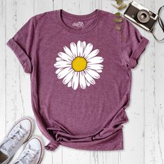 Daisy Women Shirt, Wildflower Lady Tshirt, Flower Spring Shirt, Plant Lover Tshirt, Summer Mom Shirt, Floral Outfit, Flowers Birthday Shirt Embrace the beauty of nature with our Daisy Women Shirt. This wildflower lady tshirt is perfect for adding a touch of floral charm to your spring and summer wardrobe. Whether you're a plant lover or just love the vibrant colors of flowers, this shirt is a must-have. Made from high-quality materials, this flower spring shirt is not only stylish but also comfo Purple Letter Print Shirt For Spring, Mother's Day Floral Print Crew Neck T-shirt, Graphic Tee Shirt As A Summer Gift, Crew Neck Floral Print T-shirt For Mother's Day, Floral Print Crew Neck T-shirt For Mother's Day, Cute Floral Graphic Print Tops, Floral Print Graphic Tee As Gift, Floral Print Graphic Tee As A Gift, Spring Funny Print Shirt As Gift