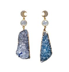 "Add a touch of celestial elegance to your jewelry collection with the stunning Celina earrings! The blue asymmetrical druzy stones are uniquely paired with luminous blue opalite connectors and are complemented by sparkling CZ moon posts for that perfect touch of glam. Suitable for any occasion, these earrings will make a statement and add a touch of glamour to any outfit.  2 1/2\" Long" Blue Drop Earrings, Druzy Earrings, Crystal Stars, Earrings Blue, Moon Earrings, Quartz Earrings, Earrings Statement, Stunning Earrings, Druzy