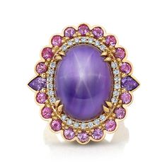 This one-of-a-kind ring is a true work of art! A rare and captivating Star Sapphire is complemented by exquisite Diamonds and shades of pink and lavender Sapphires. This ring exudes luxury, sophistication, and individuality making it a perfect symbol of unique style and refinement.18 karat yellow gold 1 Oval lavender star Sapphire, 51.57 total carat weight 18 Round pink Sapphires, 2.43 total carat weight2 Pear shaped lavender Sapphires, 1.02 total carat weight2 Oval pink Sapphires, 0.53 total ca Purple Oval Ring, Star Ruby Ring, Pink And Lavender, Colored Stone Rings, Gold Rings Fashion, Star Sapphire, Star Ruby, Oval Rings, Ruby Ring