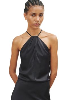 Pleated center front and back collar halter top. Skinny straps. Hidden closure. Fully lined 100% Silk Dry Clean Style#: 12486-W79 Shown with the Rosin Skirt in Black (sold separately) Collar Halter Top, Silk Halter Top, Halterneck Top, Nili Lotan, Halter Neck Top, Silk Charmeuse, Flowy Tops, Modern Woman, Halter Top