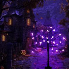 an animated halloween scene with purple lights and pumpkins in front of a creepy house