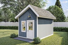 a small blue and white shed sitting in the grass