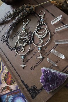 * Stunning statement Moon and Stars earrings which will give your outfit a mystical touch.  * These beautiful dangling earrings have a witchy, bohemian feel to them. * Stainless steel! * The total length of the earrings is approximately 10 cm (aprox 4 inches), hook included.  * They come in a pretty little burlap pouch 🖤 Witchy Necklace, Witchy Boho, Stars Earrings, Silversmith Jewellery, Mystical Jewelry, Moon And Star Earrings, Witch Jewelry, Witchy Jewelry, Magical Jewelry