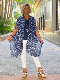 Printed Kari Kimono: Navy with White Anchors The one size Kari printed kimono completes any outfit or pairs beautifully with your favorite swimsuit! Details & Care: Cathy is 5'6 size small top and 8 jean One Size 100% viscose 37" L x 37" W Casual Rayon Kimono For Beach Cover-up, Casual Spring Cover-up With Kimono Sleeves, Casual Long Printed Cover-up, Flowy Open Front Printed Cover-up, Casual Free Size Short Sleeve Cover-up, Casual One Size Kimono For Beach Cover-up, Casual Relaxed Fit Kimono For Beach Cover-up, Casual V-neck Rayon Kimono, Spring Short Sleeve Free Size Cover-up