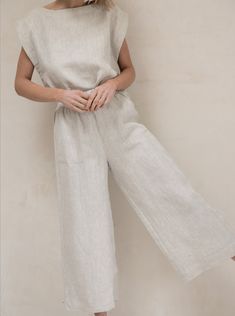 Our best-selling pant, complete with a high-waisted fit and cropped, wide-leg, back in customer favorite Natural. A cool, casual feel courtesy of our luxurious certified organic linen textile. The fully-elastic waistband offers comfort for all-day wear. Pair them with our Everyday Top for a powerful statement look or with any of our tops for a chic handmade ensemble. We appreciate the natural beauty of linen's undyed color and are excited to highlight it in our Natural colorway. Made with 100% O Relaxed Fit Linen Wide Leg Pants With Straight Hem, Summer Linen Wide Leg Pants With Straight Hem, Linen Wide Leg Pants For Summer, Solid Linen Wide Leg Pants With Relaxed Fit, Relaxed Fit Wide Leg Pants In Flax For Loungewear, Elegant Linen Pants For Loungewear, Relaxed Fit Flax Wide Leg Pants For Loungewear, Relaxed Fit Flax Wide Leg Loungewear Pants, Effortless Relaxed Fit Linen Wide Leg Pants