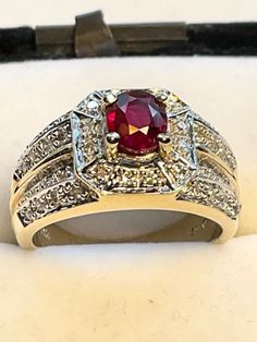 Beautiful 6mm. Madagascar Ruby set in 14kt. yellow gold. Accents with shiny Diamonds SI. Size 7. Ruby, Diamonds and gold are 100% genuine. Art Deco themed. Great Saturation. Unique, sophisticated, gorgeous Statement ring or Engagement Ring. Unisex Formal Ruby Ring With Diamond Cut In Yellow Gold, Classic Gold Ruby Ring With Diamond Cut, Classic Ruby Ring For Anniversary Stamped 14k, Classic Ruby Ring Stamped 14k For Anniversary, 14k Stamped Round Cut Ruby Ring, Ruby Set, Ruby Bands, Diamonds And Gold, Star Ring