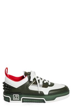 A '90s-inspired street-savvy silhouette that borrows from basketball and skate shoes of the era defines this mixed-media sneaker bristled with signature spikes. Lace-up style Removable insole Leather and textile upper/textile lining/synthetic sole Imported Designer Shoes Sporty Spiked Leather Sneakers, Designer Custom Sneakers With Studded Outsoles For Streetwear, Sporty Mid-top Basketball Shoes With Studded Outsoles, White Low-top Sneakers With Spikes, Designer Low-top Sneakers With Spikes, Sporty Low-top Basketball Shoes With Studded Outsoles, Sporty High-top Sneakers With Spikes And Round Toe, Sporty High-top Sneakers With Spikes, Sporty Custom Sneakers With Spikes For Streetwear