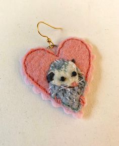 a hedgehog in a heart shaped felt ornament