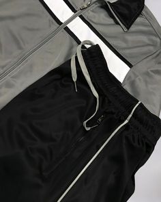 Upgrade your athletic wardrobe with our Men's Tracksuit Contrast Color Set. This luxury sports set features a striking contrast color design, adding a touch of sophistication to your workout or casual wear. Stay stylish and comfortable in this exclusive matching outfit. Features: Contrast color styling matching 2-piece outfit Full zip up activewear jacket with 2 zippered side pockets Track pants with 2 zippered side pockets, an elastic waist with adjustable drawstrings and trimmed jogger bottoms Sportswear Activewear With Contrast Trim, Sports Activewear With Contrast Trim, Sporty Gym Activewear With Contrast Trim, Black Activewear With Contrast Stripes For Workout, Sporty Activewear With Contrast Panels For Training, Sporty Training Activewear With Contrast Panels, Sporty Activewear For Training With Contrast Panels, Athleisure Activewear With Contrast Trim For Gym, Sportswear Tracksuit With Side Stripes For Sports