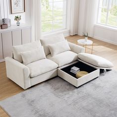 a living room with a sectional couch and ottoman