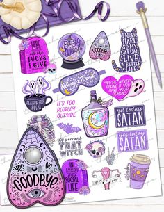 the purple sticker sheet is next to a pen and some other things on it