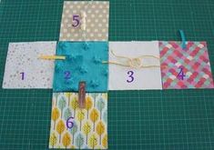 the quilts are laid out and ready to be sewn together, with numbers on them