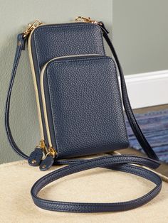 With this compact and versatile bag, you can keep essentials with you without carrying a cumbersome bag! It has a vertical design, making it easy to access what you need, and features two main compartments, a zip-around closure, a front zipper pocket, an ID window, four card slip pockets, and RFID-blocking protection. It also has a removable shoulder strap so you can use the bag as a clutch. Vertical crossbody style: wear as a crossbody or use as a clutch Beautiful pebble-grain texture Two main Functional Blue Phone Bag With Cell Phone Pocket, Versatile Blue Phone Bag With Removable Pouch, Versatile Blue Phone Bag For Travel, Versatile Blue Phone Bag For Everyday Use, Versatile Blue Phone Bag, Blue Versatile Phone Bag For Everyday Use, Versatile Portable Blue Phone Bag, Versatile Everyday Blue Phone Bag, Portable Blue Phone Bag For Everyday Use