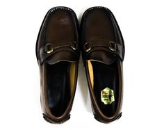 "These 1960s boy's loafers are classic preppy shoes with bronzed metal buckle, top-stitched details and its original shoe box. The 60s sale price was $6.00. Child's Size Marked 2 1/2 D Measurements Ball of Foot Width 3 1/8, Toe to Heel 9 1/8 Inches (measurements taken at insole of shoe) Era 1960s Label ' Poll / Parrot / PRE / TESTED ' to gold foil sticker at insole, with same brand on outside of box; the box shows the design was originally called ' Chouteau ' and its color was named ' Burnt Suga Vintage Brown Moc Toe Loafers, Vintage Wingtip Moccasins For Work, Vintage Moc Toe Loafers For Work, Vintage Leather Sole Moccasins For Business, Vintage Moccasins With Leather Sole And Moc Toe, Vintage Brown Goodyear Welted Loafers, Brown Vintage Goodyear Welted Loafers, Vintage Moccasins With Rubber Sole For Work, Vintage Moccasins With Rubber Sole For Formal Occasions