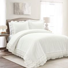 PRICES MAY VARY. The delicate lace and ruffled trim on this duvet cover set brings your cottagecore dreams to life. Designed to be layered with your favorite throws and accessories, this elegant and cozy duvet cover has a simple look with a lot of style. With this delicately trimmed duvet cover set, you can finally give into your cottagecore dreams. Made with 100% cotton, layers of airy ruffles and lace trace the edge of the duvet cover and two matching shams. The duvet cover is equipped with fo Minimalist Cottage, Ruffle Comforter, Ruffle Duvet Cover, Farmhouse Style Bedrooms, 100 Cotton Duvet Covers, White Comforter, White Duvet, Lush Decor, Ruffle Bedding