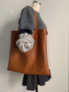 "This is a hand stitched full grain cowhide leather tote. The body measures 17 1/2\"w x 16 1/2\"h and there is one interior cell phone pocket. The straps are 23\"l and the strap drop is 10\". The second picture shows the back of the bag which features a beautiful natural texture that a little more distressed than the front." Girl Short Hair, Natural Texture, Hand Stitched, Cowhide Leather, Tan Leather, Picture Show, Hand Stitching, Leather Tote, Short Hair