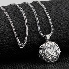 Beautiful an absolutely Gorgeous 925 Sterling Silver Taweez Locket - Islamic Crossed Zulfiqar Amulet Muslim Charm Talisman box Pendant Necklace Prayer Box Pill box Locket screw opened by twisting. Both front and back sides have Crossed Zulfiqar script design ornament. Necklace Length : 60 cm (23.62" inches). Pendant height : 2.9 cm (1.14" inches) Pendant width : 2.2 cm (0.86" inches) Pendant diameter : 22 mm diameter opened by twisting Pendant thickness : 10 mm Weight : 16 grams. ★ Real colors m Traditional Silver Box Chain Jewelry, Traditional Sterling Silver Jewelry With Box Chain, Traditional Sterling Silver Box Chain Jewelry, Antique Box Chain Jewelry Gift, Schrift Design, Prayer Box, Alex And Ani Charm Bracelet, Locket, Jewelry Necklace Pendant