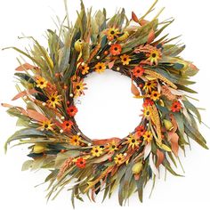 a wreath with orange and yellow flowers on it