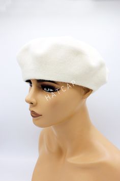 Our French felt beret with many beautiful different colors are perfect accessories for winter. Our women hats are knitting from felt , and one size fits all. It's very chic and warm Color : Cream, white All of our products are Free Express Shipping. White Winter Beret Cap, White Winter Beret, Adjustable White Felt Hat For Winter, Winter Flat Cap Beret For Gift, Flat Cap Hats As Winter Gifts, Winter Gift Beret Flat Cap, Cream Winter Hat As Gift, White Hat One Size Gift, White Wool Cap